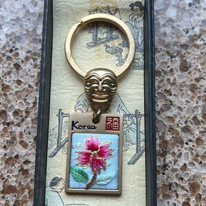 Gold Tone Korean Mask Keychain with Flower 🌺 Tag In Box 🗃️ engraved Korea back